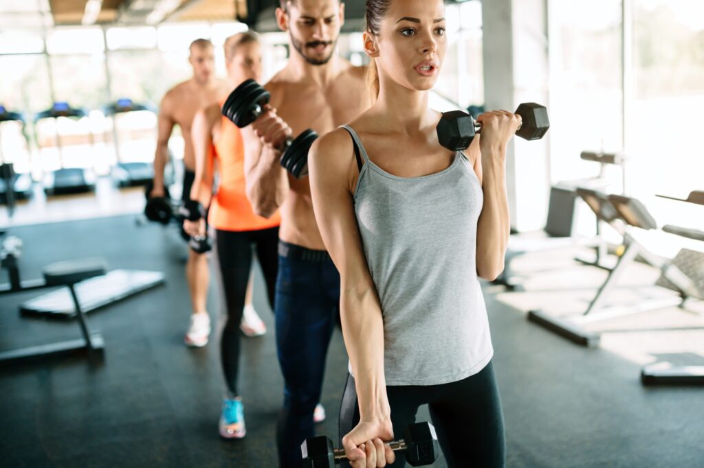 Group of people training in gym